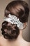Portrait of a beautiful woman in the image of the bride with lace in her hair. Beauty face.Hairstyle back view