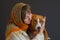 Portrait of beautiful woman with lovely basenji dog