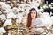 Portrait of beautiful woman with magnolia flowers. Spring time