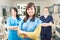 Portrait of beautiful woman patient with dental team in background