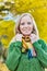 Portrait of Beautiful woman standing and smiling while holding her scarf