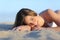 Portrait of a Beautiful woman sunbathing lying on the beach