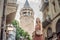 Portrait of beautiful woman tourist with view of Galata tower in Beyoglu, Istanbul, Turkey. Turkiye