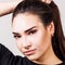 Portrait of beautiful woman with vitiligo in black t-shirt.