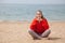 Portrait of beautiful woman Yogi on the beach