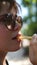 Portrait of a beautiful woman . A young woman eating french fries in the Park