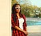 Portrait of beautiful young african woman posing wearing casual, sunglasses in the city