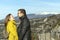 Portrait of beautiful young couple looking at each other and smiling, french mountain background, Provence, France