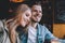 Portrait of beautiful young couple in love at a coffee shop.