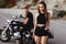 Portrait of beautiful young couple on a motorcycle.