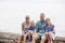 Portrait of a beautiful young Family on the edge of a lake