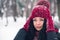 Portrait of a beautiful young girl with snowflakes on her eyelashes