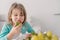 portrait of a beautiful young girl tasting a strawberry