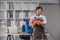 Portrait of a beautiful young housewife smiling and happy, holding cleaning supplies in the office. cleaning supplies