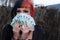 Portrait of a beautiful young individual, eccentric woman, holding many euro banknotes. Basic income citizen money in hand
