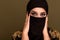 Portrait of beautiful young muslim arabian woman wearing hijab looking at camera, copy space