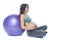 Portrait of a beautiful young pregnant woman exercises with fitball. Working out and fitness, pregnancy concept