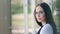 Portrait beautiful young successful businesswoman in glasses calm and thoughtful looking at camera