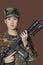 Portrait of beautiful young US Marine Corps soldier with M4 assault rifle over brown background