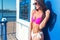 Portrait of beautiful young woman in bikini on beach posing.