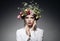 Portrait of beautiful young woman with flowers in hair