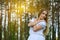 Portrait of beautiful young woman in pine forest