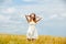 Portrait of beautiful young woman on the wonderful wheat field b