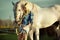 Portrait of a beauty blondie with horse