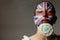 Portrait Beauty Woman with painted british flag holding Colorful lollipop