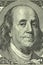 Portrait of Benjamin Franklin on the banknote in a hundred American dollars