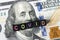 portrait of Benjamin Franklin from hundred-dollar bill with a closed mouth and the caption title covid. global financial economic