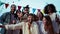 Portrait of a big group of happy young best friends smiling and having fun celebrating a buddies rooftop party, social