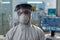 Portrait of biologist researcher in coronavirus protective medical equipment