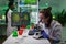 Portrait of biologist scientist in white coat working in expertise laboratory