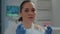 Portrait of biologist taking off face mask in laboratory