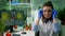 Portrait of biologist woman putting medical glasses looking into camera