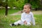 Portrait of a black baby boy playing at park