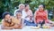 Portrait of a black father and child at a picnic with family in an outdoor green garden during spring. Smile, happy and