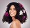 Portrait, black woman and hair care, flowers and shine with smile, girl and grey studio background. Face, African