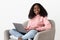 Portrait of black woman independent contractor using laptop