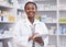 Portrait of black woman in pharmacy with tablet, smile and online inventory list for medicine on shelf. Happy female