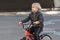 Portrait of blond boy on Bicycle. A child learning to ride bike