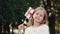 Portrait of blond girl holding English flag in park