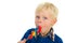 Portrait of a blond little boy eating a lolly