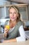 Portrait of blond woman with glass of juice