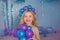 Portrait of blonde little girl with a balloons in a hands