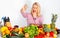 Portrait of blonde long-haired happy woman with Heap Of Vegetables. Isolated.