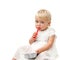 Portrait of blue eye baby girl with red spoon