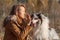 Portrait of Blue Merle Rough Collie and Girl in Autumn Park