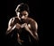 Portrait, body of man and boxer fight in studio  on a black background. Face, boxing and muscle of topless